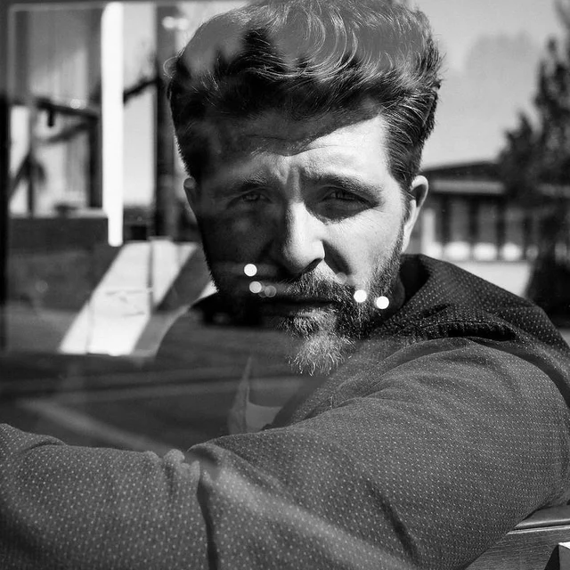 Black-and-white portrait release artwork